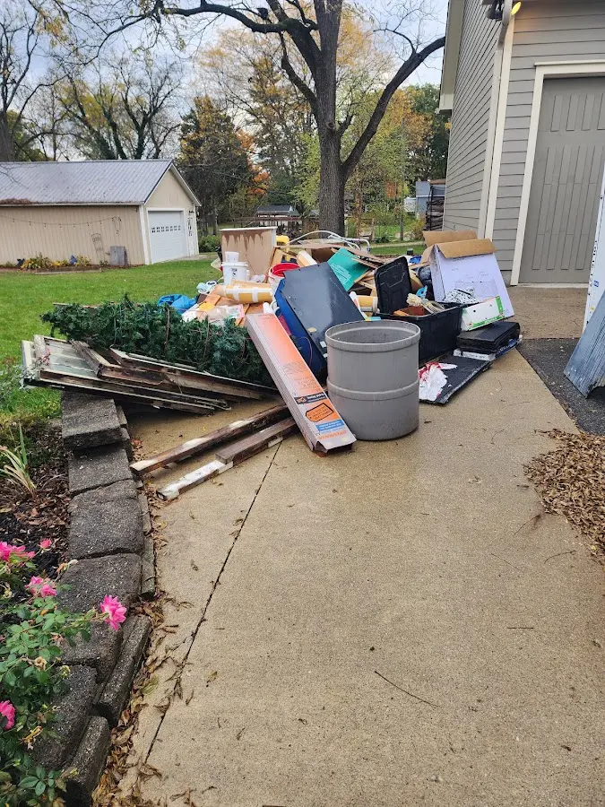 Dumpster being loaded with debris for Demolition Dumpster Rental in Honesdale